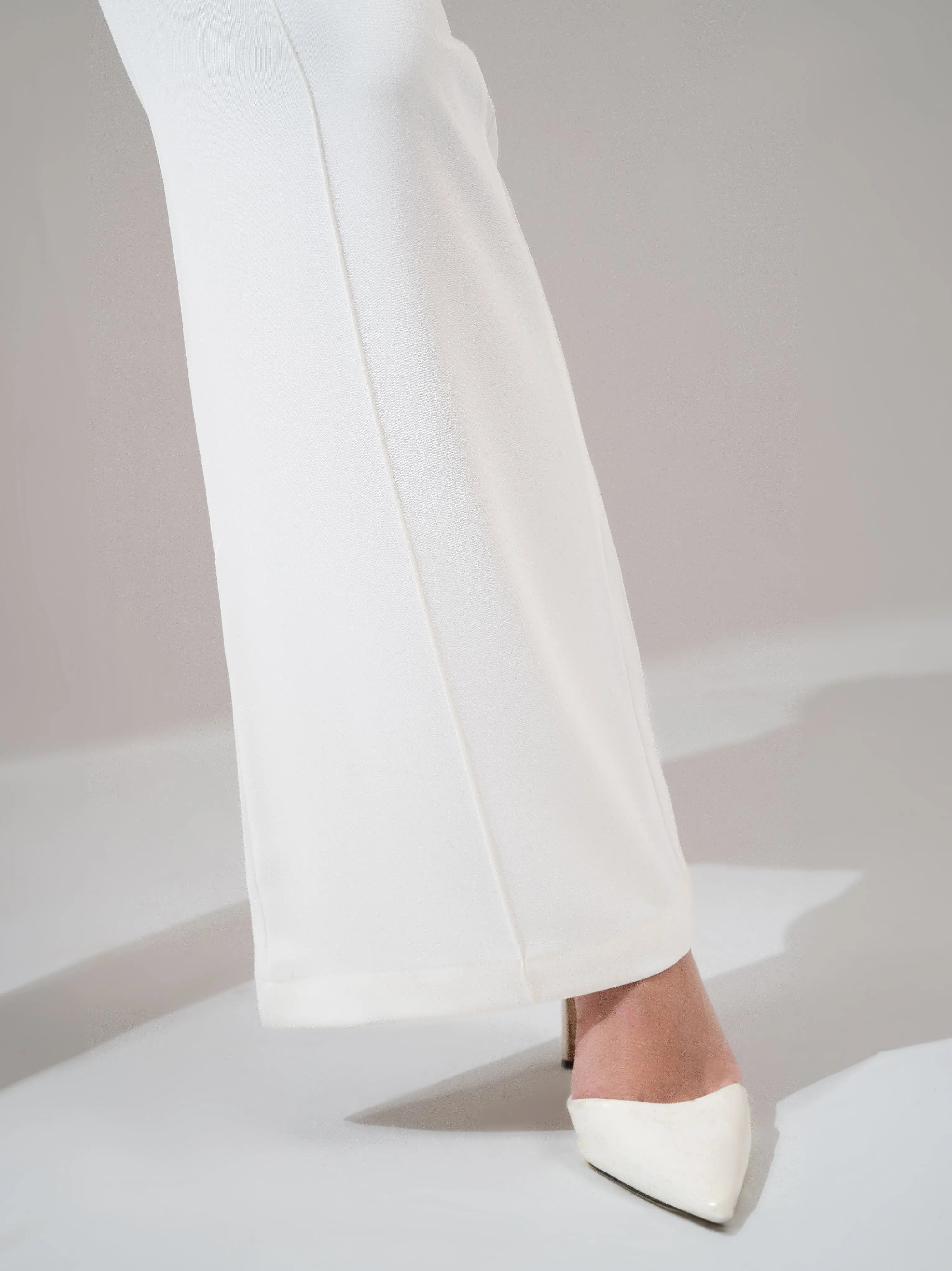 High-waist flared trousers – White