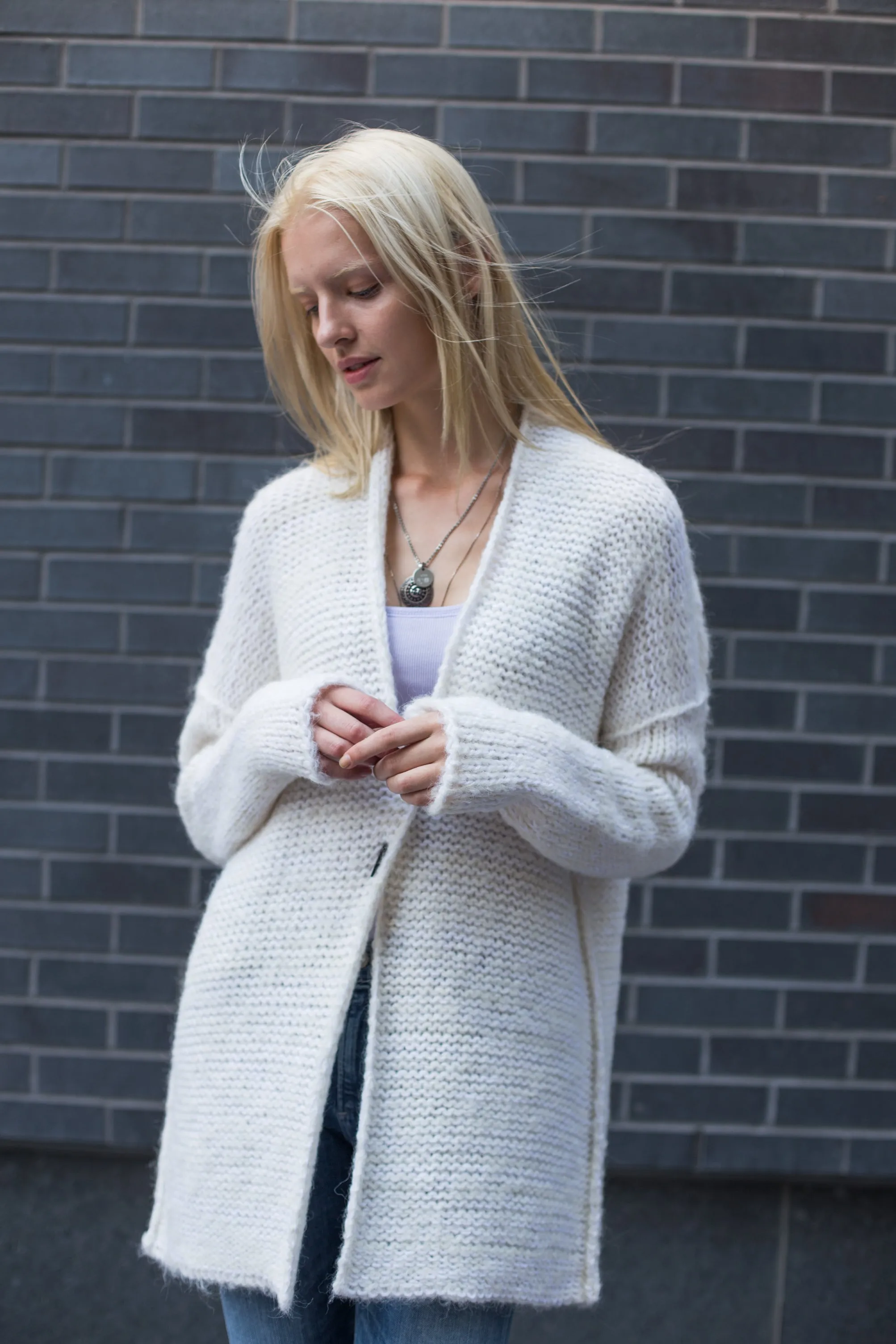 White alpaca knit cardigan.